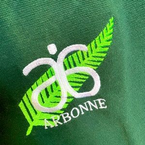 Two Jerezes collar pollo shirt with Arbonne logo two sizes M and L.